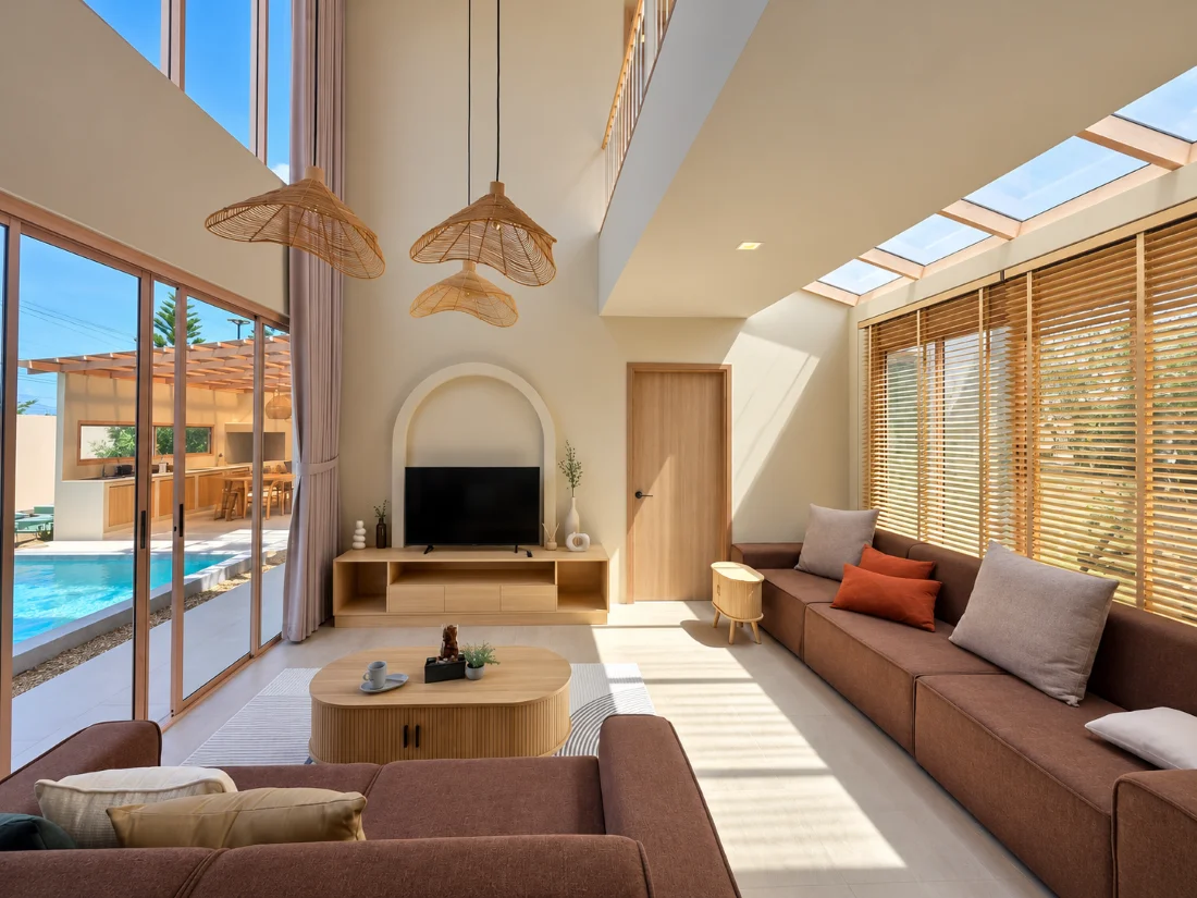 Khao Yai Pool Villa living room with curtains and wooden blinds